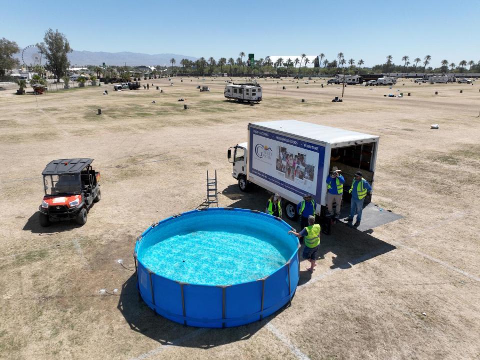 Aerial view of crews draining a reusable swimming pool in The RV Resort area that will be