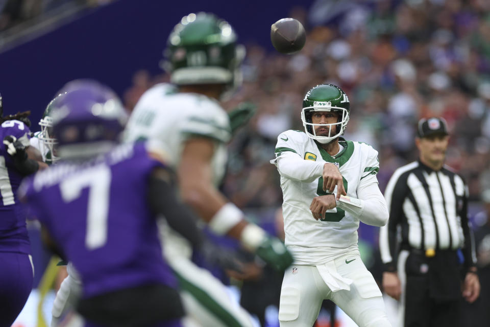 New York Jets quarterback Aaron Rodgers throws during the first half of an NFL football game against the Minnesota Vikings, Sunday, Oct. 6, 2024, at the Tottenham Hotspur stadium in London. (AP Photo/Ian Walton)