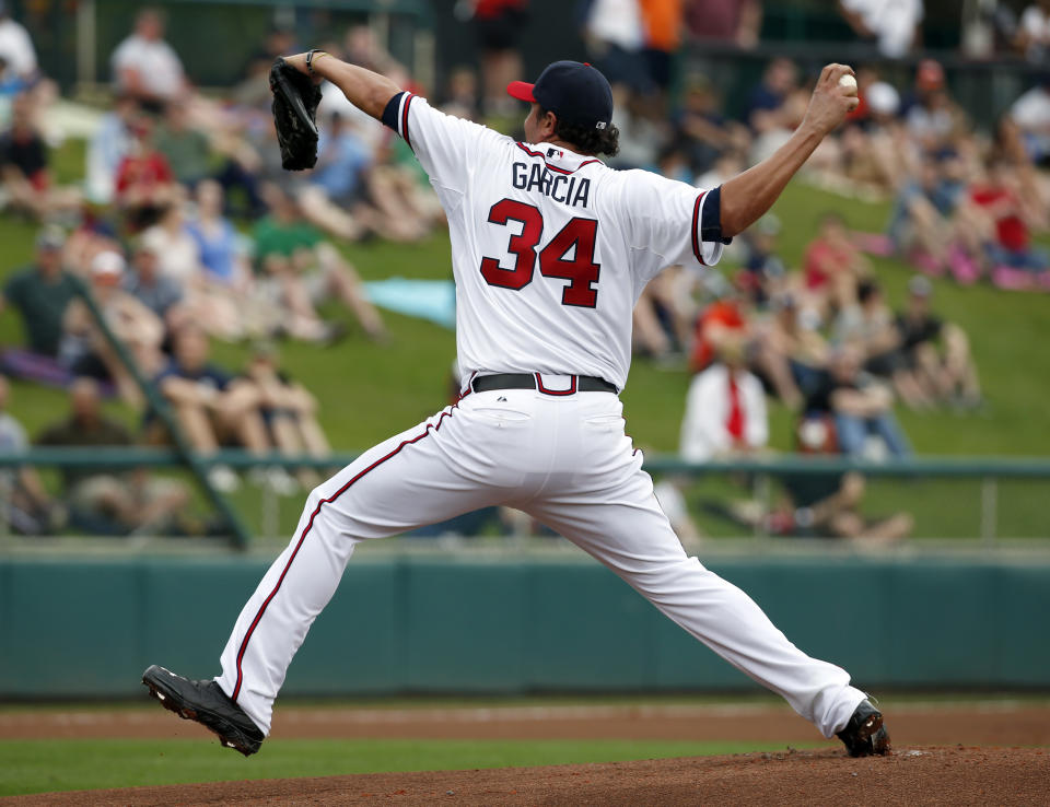 Atlanta Braves starting pitcher Freddy Garcia throws in the first inning of a spring exhibition baseball game against the Detroit Tigers, Wednesday, Feb. 26, 2014, in Kissimmee, Fla. (AP Photo/Alex Brandon)