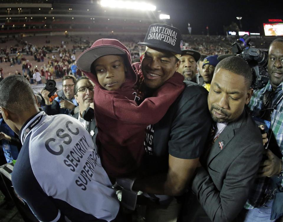 Florida State's Jameis Winston with his brother Jonah after the NCAA BCS National Championship college football game against Auburn Monday, Jan. 6, 2014, in Pasadena, Calif. Florida State won 34-31. (AP Photo/Chris Carlson)