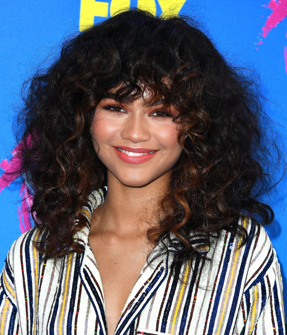 Curly Bangs Are Everywhere Right Now — Here’s How to Wear Them