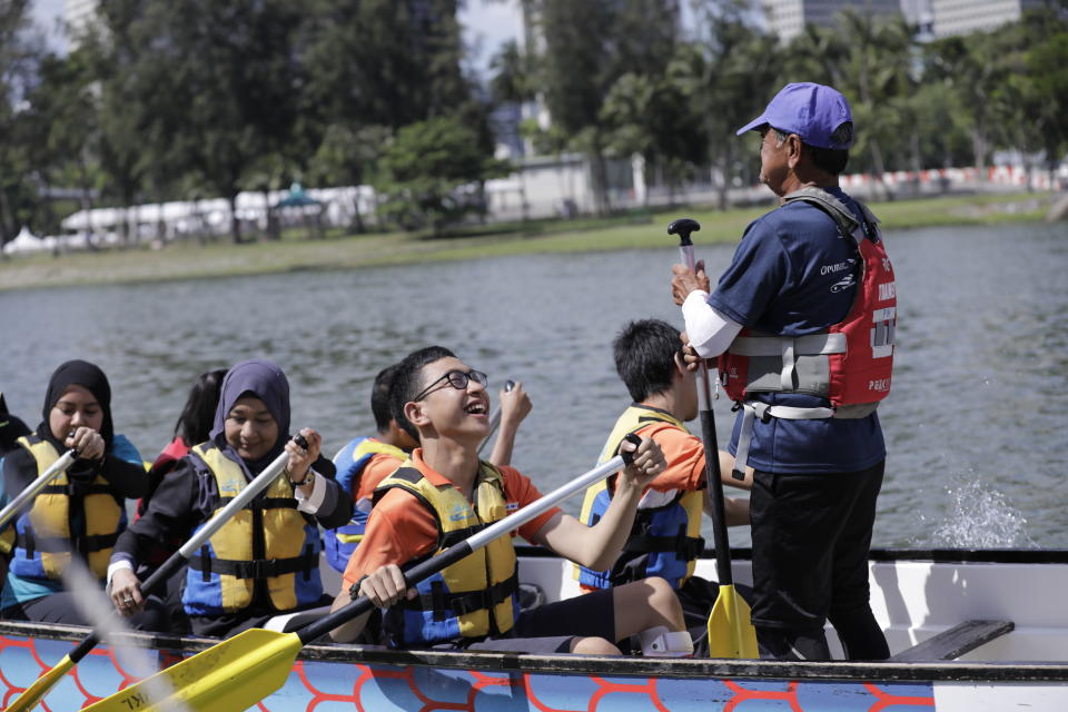 Participants trying out dragonboating at the Let’s Play! carnival at PAssion WaVe@Marina Bay. (PHOTO: People’s Association Water-Venture)