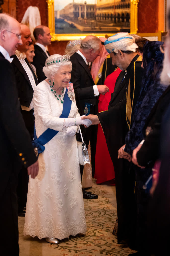 The Queen looked timeless in a white gown by Angela Kelly [Photo: Getty]