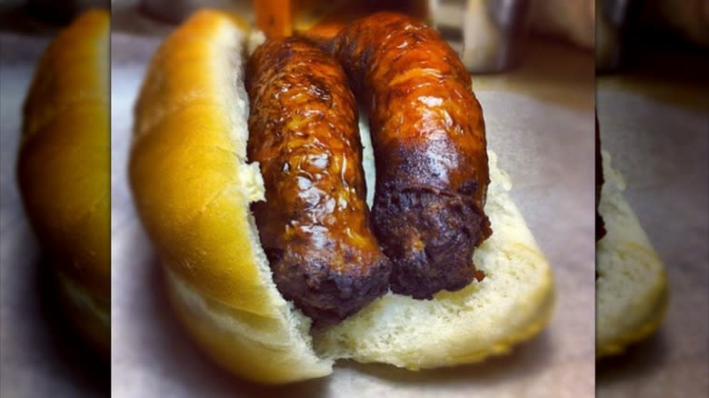 close up of two sausages in a roll