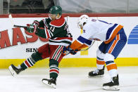 New York Islanders defenseman Ryan Pulock (6)uses his stick to upend New Jersey Devils left wing Andreas Johnsson (11) during the second period of an NHL hockey game, Tuesday, March 2, 2021, in Newark, N.J. (AP Photo/Kathy Willens)