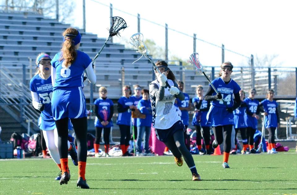 Bloomington's Ana Henderson attacks the goal during a girls' lacrosse game in the spring of 2021 against Evansville Memorial. Bloomington girls' lacrosse will be entering its ninth season this year.