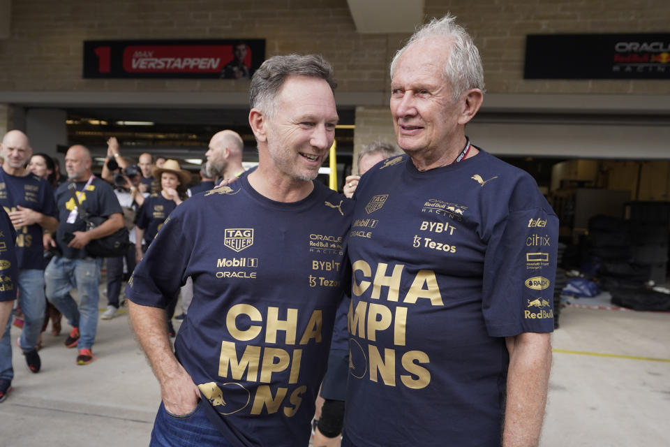 Red Bull team principal Christian Horner, left, and Helmut Marko, right, head of Red Bull Motorsports, talk following the Formula One U.S. Grand Prix auto race at Circuit of the Americas, Sunday, Oct. 23, 2022, in Austin, Texas. (AP Photo/Darron Cummings)