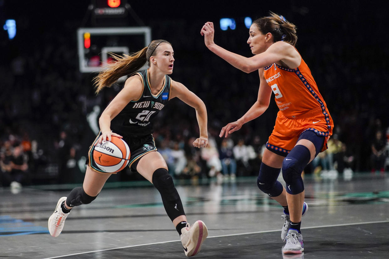 New York Liberty guard Sabrina Ionescu dribbles against Connecticut Sun guard Rebecca Allen during Game 1 of the WNBA semifinals on Sept. 24, 2023, at Barclays Center in New York. (AP Photo/Eduardo Munoz Alvarez)