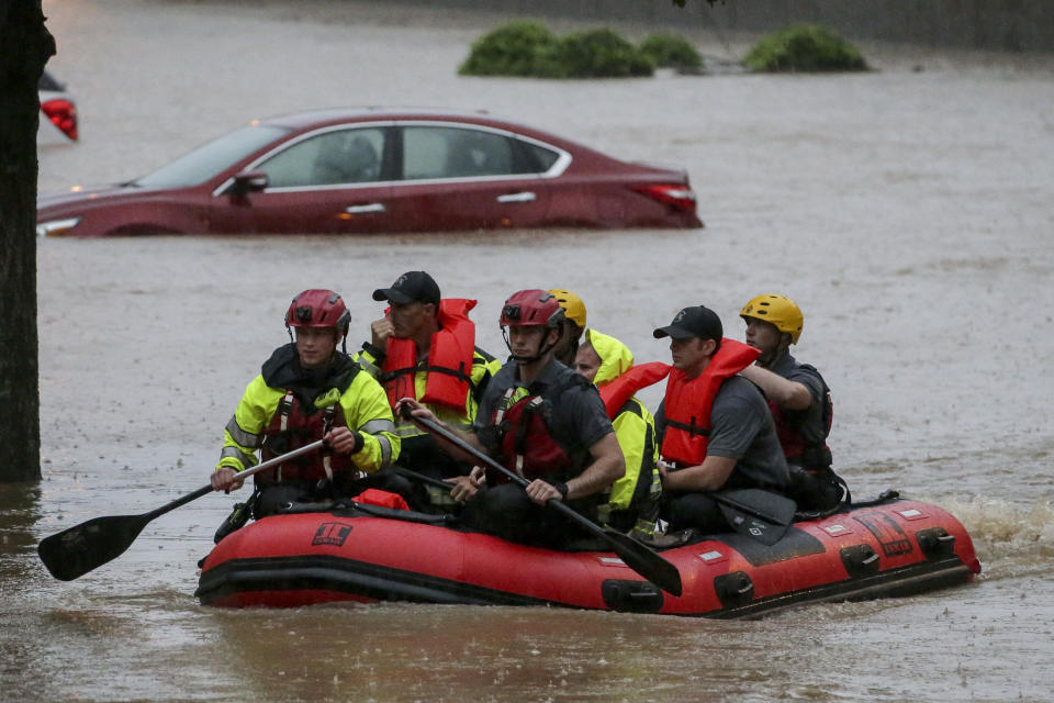 Residents of the Crescent at Lakeshore apartment complex are rescued by Homewood Fire and Rescue as severe weather produced torrential rainfall flooding several apartment buildings Tuesday, May 4, 2021 in Homewood, Ala. (AP Photo/Butch Dill)