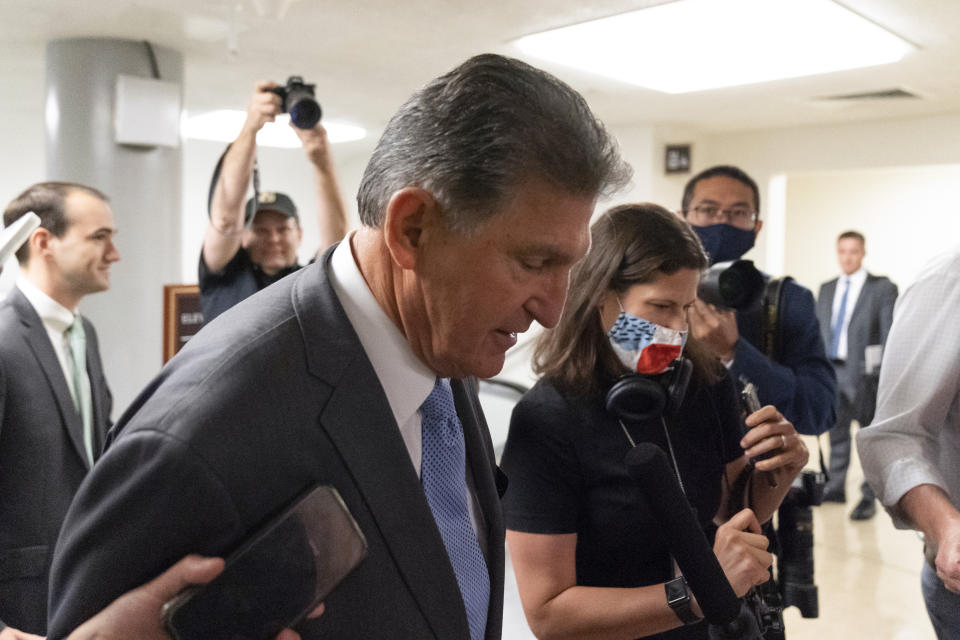 Sen. Joe Manchin, D-W.Va., talks with reporters as he walks to a vote on Capitol Hill, Tuesday, June 8, 2021, in Washington. (AP Photo/Alex Brandon)