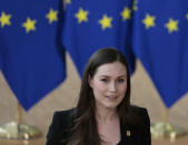 Finnish Prime Minister Sanna Marin speaks with the media as he arrives for an EU summit at the European Council building in Brussels, Friday, Feb. 21, 2020. In a second day of meetings EU leaders will continue to discuss the bloc's budget to work out Europe's spending plans for the next seven years. (AP Photo/Virginia Mayo)