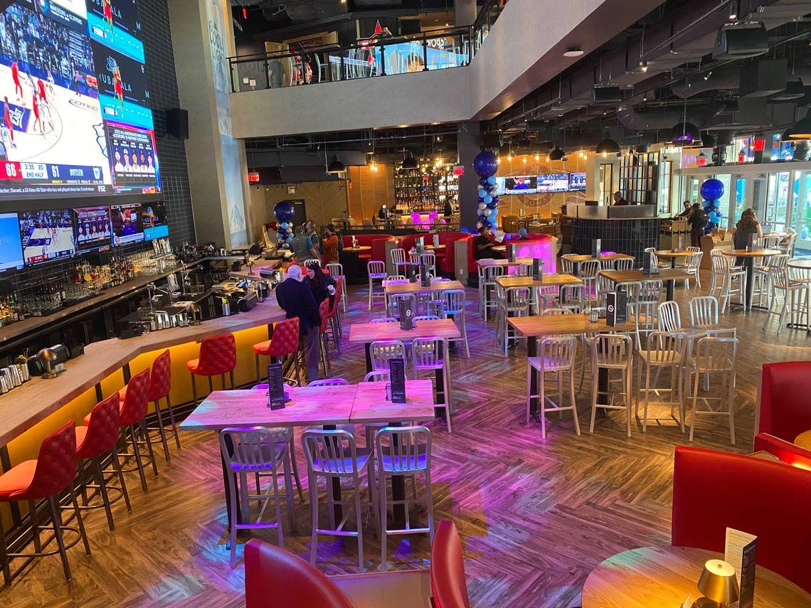 Sports fans can gather to watch their favorite team on the massive LED screen at Sports & Social, located in Cary’s Fenton development.