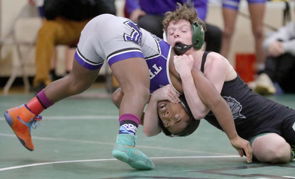 Aurora's Luke Green, shown wrestling at Brecksville earlier this season, won a sectional title Saturday.