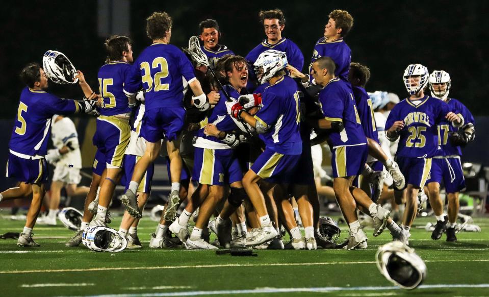 The Norwell High boys lacrosse team celebrated after the Division 3 state title game against Medfield on the campus of Worcester State University on Wednesday, June 22, 2022.