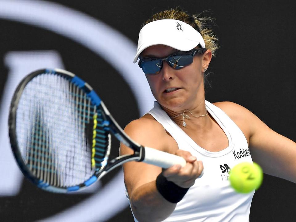 Belgium's Kirsten Flipkens makes a forehand return to Britain's Johanna Konta during their first round match at the Australian Open tennis championships in Melbourne, Australia, Tuesday, Jan. 17, 2017. (AP Photo/Andy Brownbill)