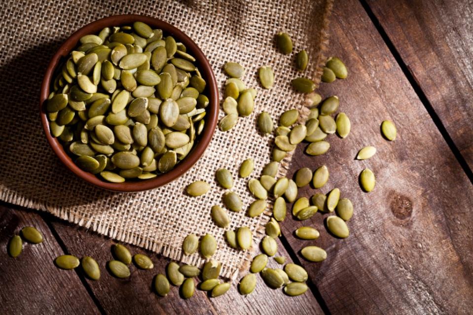 “Pumpkin seeds are a great source of tryptophan, an amino acid that supports mood regulation by aiding in the production of serotonin, a neurotransmitter associated with feel-good feelings,” one dietitian said. Getty Images/iStockphoto