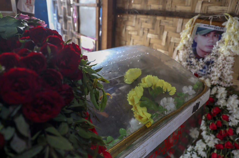 Body of Saw Pyae Naing is placed in a coffin at his hime in Mandalay, Myanmar, Sunday, March 14, 2021. Saw Pyae Naing, a 21-year old anti-coup protester was shot and killed by Myanmar security forces during a demonstration on Saturday, according to his family. (AP Photo)