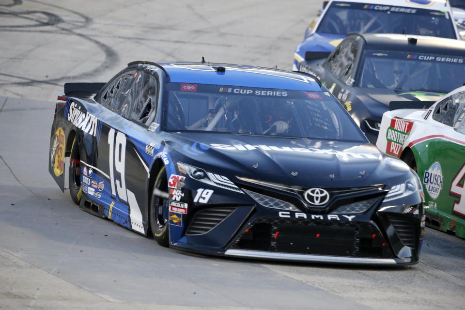 Martin Truex Jr. (19) drives during a NASCAR Cup Series auto race Wednesday, June 10, 2020, in Martinsville, Va. (AP Photo/Steve Helber)