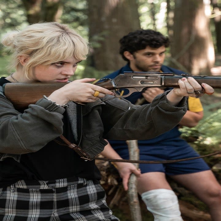 Sophie Thatcher aims a gun with Steven Krueger and Samantha Hanratty