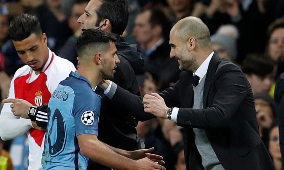 Manchester City's Sergio Agüero with Pep Guardiola after being substituted against Momaco