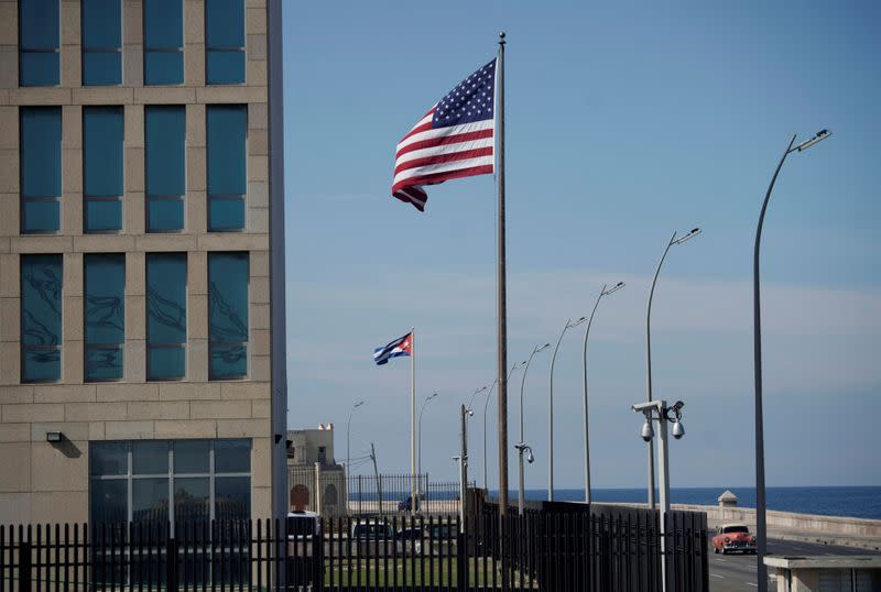 FILE PHOTO: A view of Cuban and American flags beside the U.S. Embassy in Havana