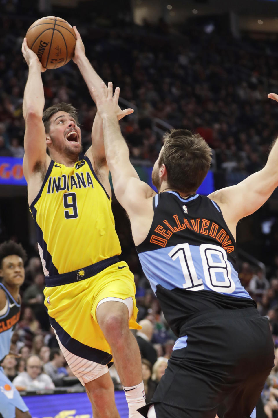 Indiana Pacers' T.J. McConnell (9) shoots over Cleveland Cavaliers' Cedi Osman (16) in the second half of an NBA basketball game, Saturday, Feb. 29, 2020, in Cleveland. Indiana won 113-104. (AP Photo/Tony Dejak)