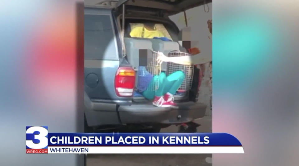 Police in Tennessee say a woman has been charged with transporting two young children in pet kennels inside her vehicle. Photo: WREG.com