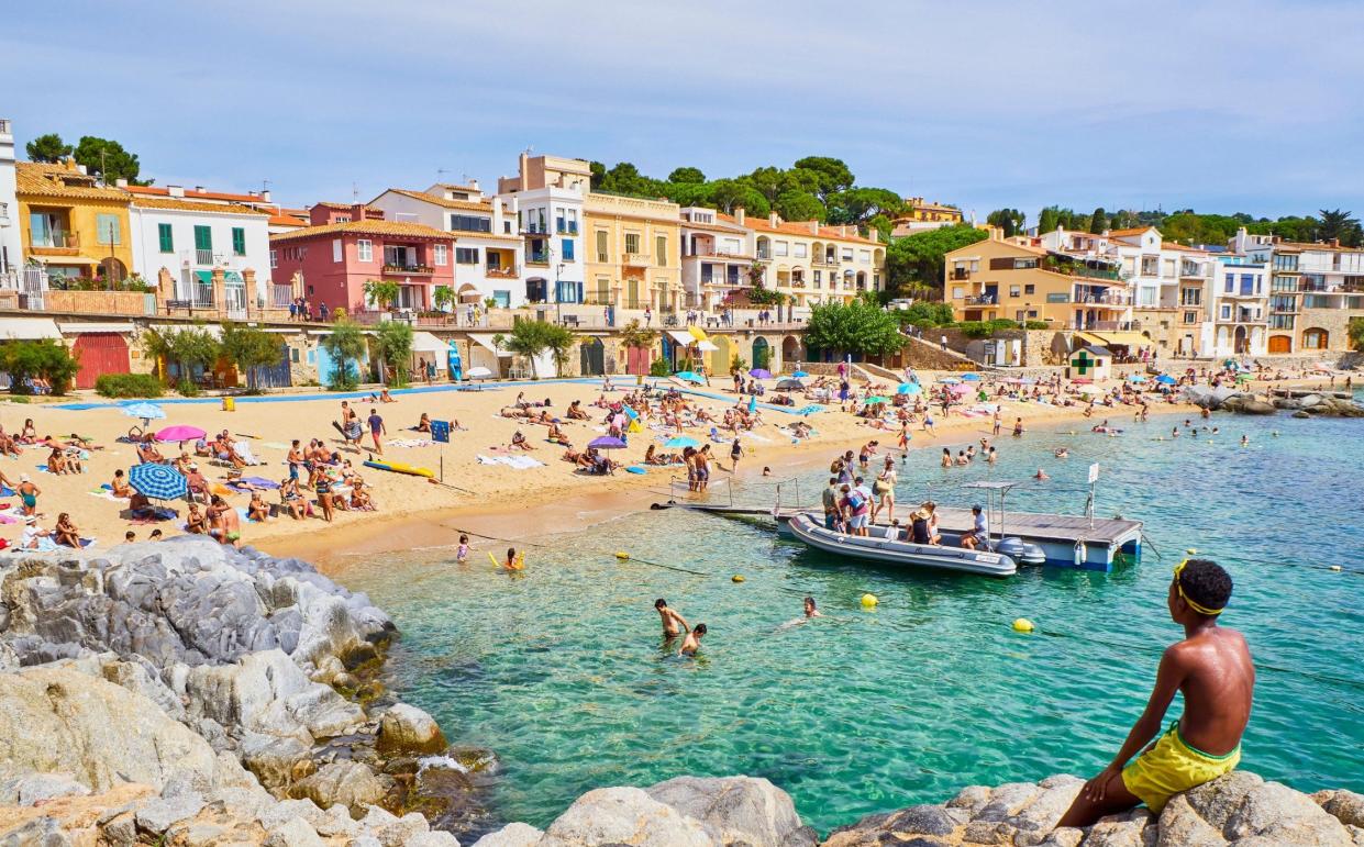 Tourists sunbathing in Platja del Canadell