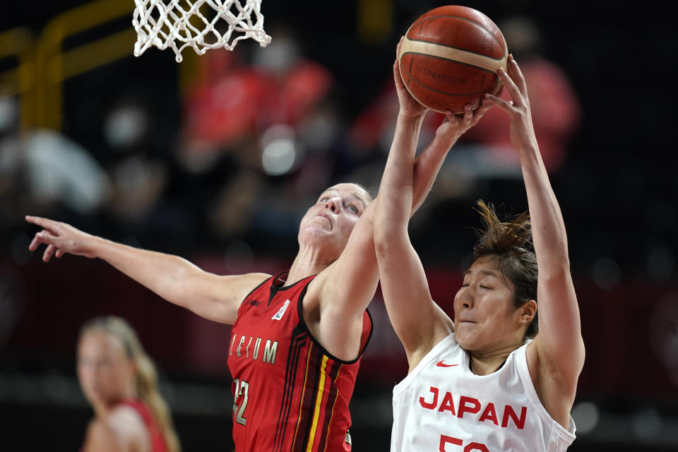 Belgium's Jana Raman (42) battles for a rebound with Japan's Yuki Miyazawa, right, during a women's basketball quarterfinal round game at the 2020 Summer Olympics, Wednesday, Aug. 4, 2021, in Saitama, Japan. (AP Photo/Charlie Neibergall)