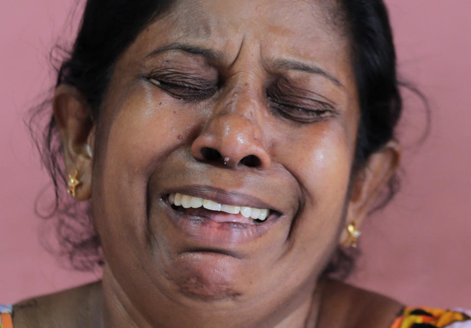 A 52-year-old Buddhist factory worker Anoma Damayanthi weeps as she talks about her 25-year-old daughter, married into a Christian family, who was seriously injured in the blast at St. Anthony's Church on Easter Sunday, at her residence in Colombo, Sri Lanka, Thursday, April 25, 2019. Liyanage herself was at St. Anthony’s, and escaped the bomb only because she left a few minutes earlier with her Christian son-in-law when her 1 and a half-year-old granddaughter began crying too loudly. (AP Photo/Eranga Jayawardena)