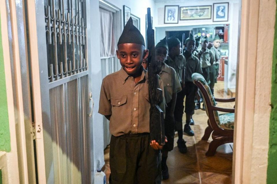 Afro-Colombian boys dressed as soldiers take part in the "Adoraciones al Nino Dios" celebrations in Quinamayo, department of Valle del Cauca, Colombia