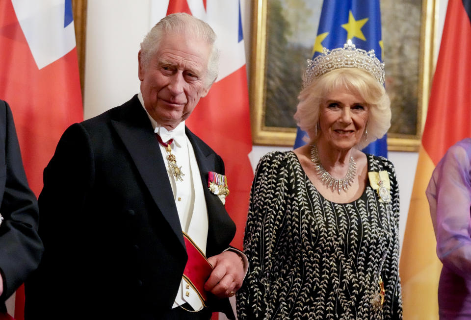 Britain's King Charles III, and Camilla, the Queen Consort, stand together prior to the State Banquet in the Bellevue Palace in Berlin, Wednesday, March 29, 2023. King Charles III arrived Wednesday for a three-day official visit to Germany. (AP Photo/Matthias Schrader, Pool))