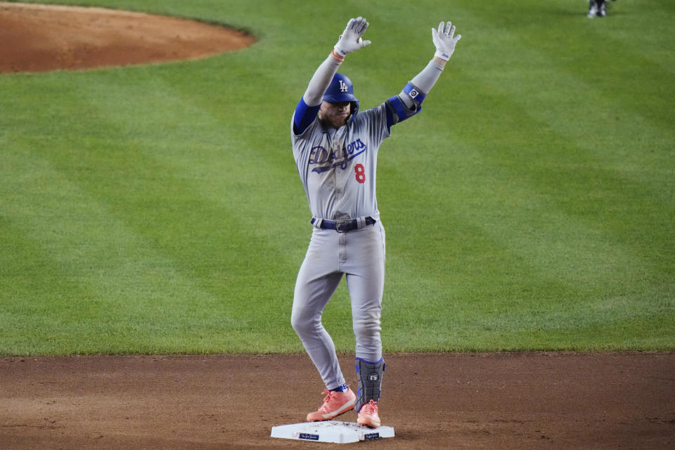 Los Angeles Dodgers' Kiké Hernández (8) gestures to fans after hitting a double during the seventh inning of a baseball game against the New York Yankees, Friday, June 7, 2024, in New York. (AP Photo/Frank Franklin II)