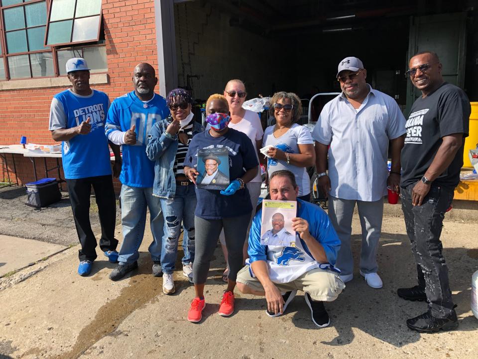 Friends and family of former fire fighter Frank Williams, who died this year from COVID-19, gather to tailgate in downtown Detroit before the Detroit Lions game against the Chicago Bears at Ford Field on Sunday, Sept. 13, 2020.