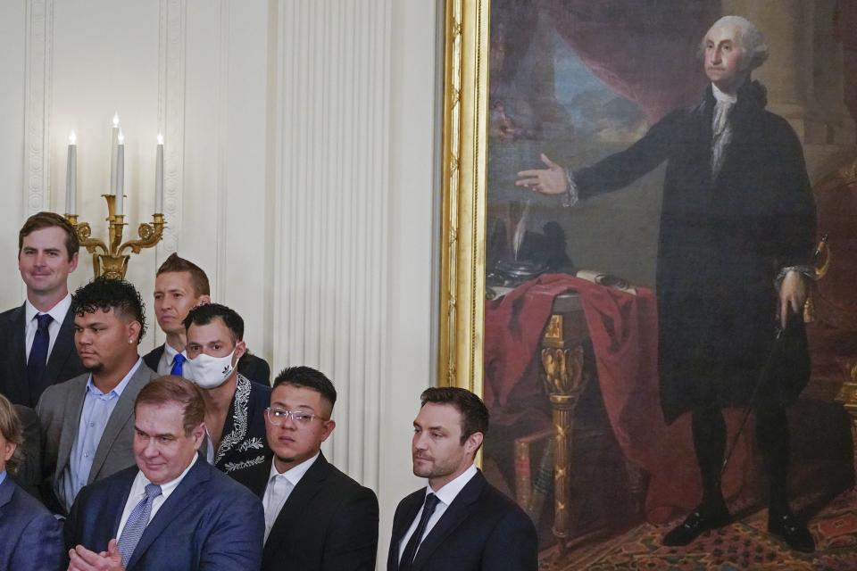 A painting of George Washington is seen next to members of the Los Angeles Dodgers during an event honoring them for their 2020 World Series baseball championship at the White House on July 2, 2021, in Washington. | Julio Cortez, Associated Press