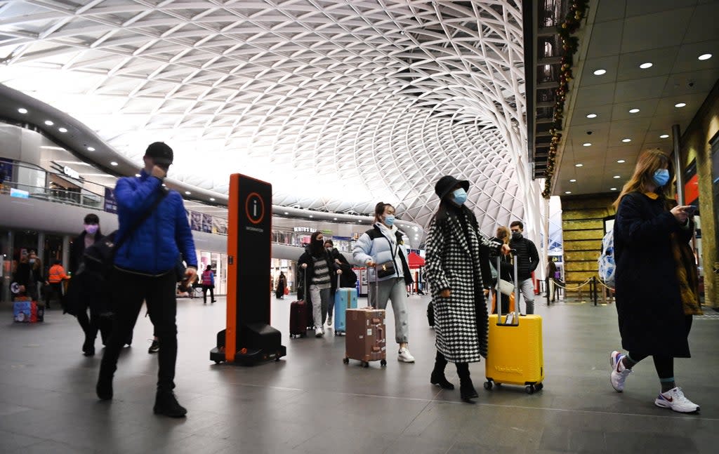People at Kings Cross train station in London in December 2020 [stock photo]  (EPA)