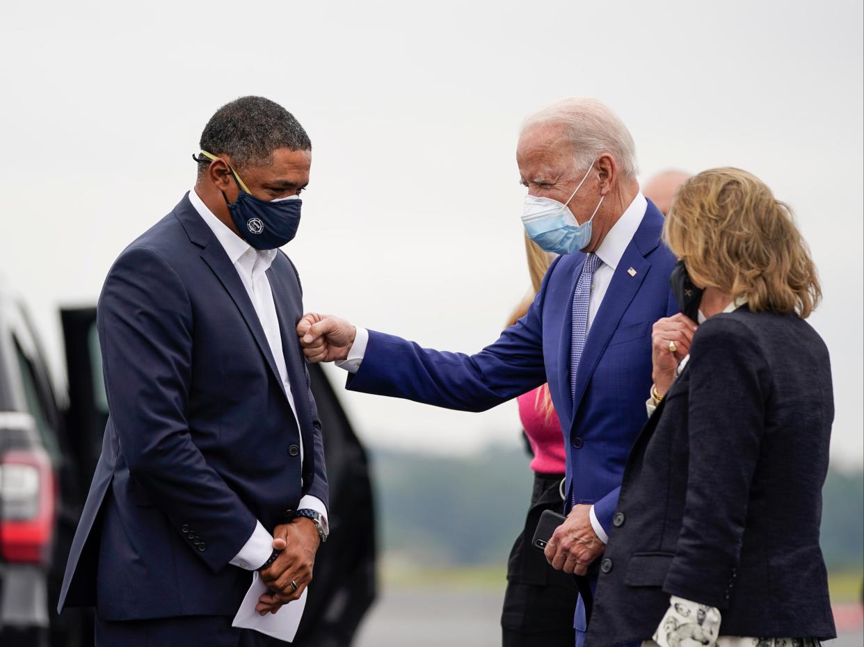 Cedric Richmond (D-LA) and Democratic presidential nominee Joe Biden greet each other as Biden arrives at Columbus Airport on 27 October 2020 in Columbus, Georgia ((Getty Images))