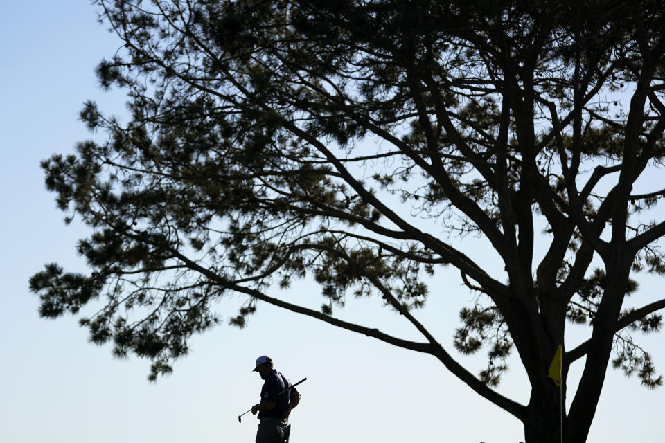 Jon Rahm, of Spain, waits to putt on the 16th hole of the South Course at Torrey Pines during the third round of the Farmers Insurance Open golf tournament, Friday, Jan. 27, 2023, in San Diego. (AP Photo/Gregory Bull)