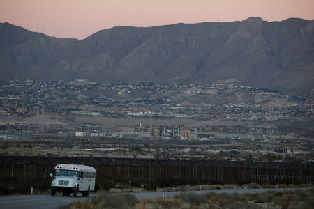 A bus passes by a newly built section of the U.S.-Mexico border wall at Sunland Park, U.S. opposite the Mexican border city of Ciudad Juarez, Mexico November 24, 2016. Picture taken from the Mexico side of the U.S.-Mexico border. Picture taken November 24, 2016. REUTERS/Jose Luis Gonzalez