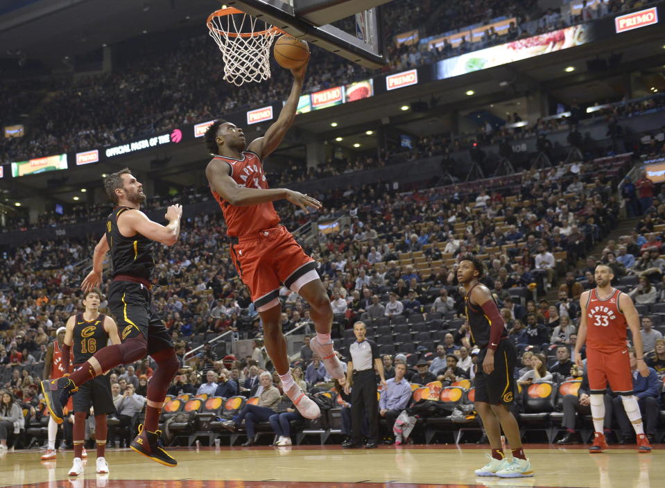 Toronto Raptors forward OG Anunoby (3) scores on a layup past Cleveland Cavaliers forward Kevin Love (0) during second half NBA basketball action in Toronto on Monday, Dec. 16, 2019. (Nathan Denette/The Canadian Press via AP)