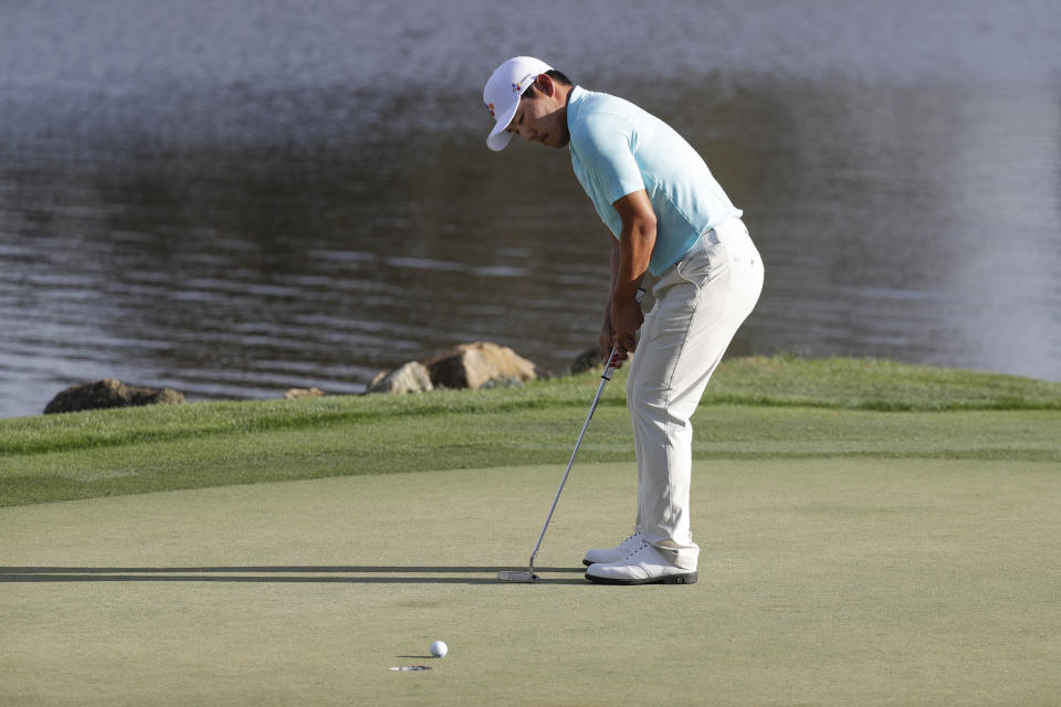 Sung Kang, of South Korea, sinks a birdie putt on the 18th hole during the second round of the Arnold Palmer Invitational golf tournament Friday, March 6, 2020, in Orlando, Fla. (AP Photo/John Raoux)