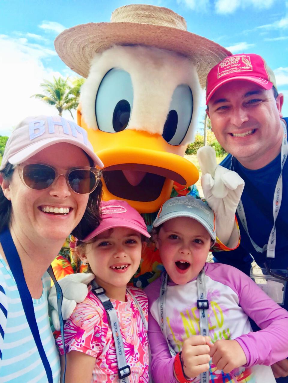 the writer and her family with her two kids, husband, and donald duck 