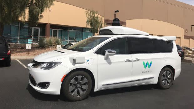 A Waymo self-driving vehicle is parked outside the Alphabet company's offices.