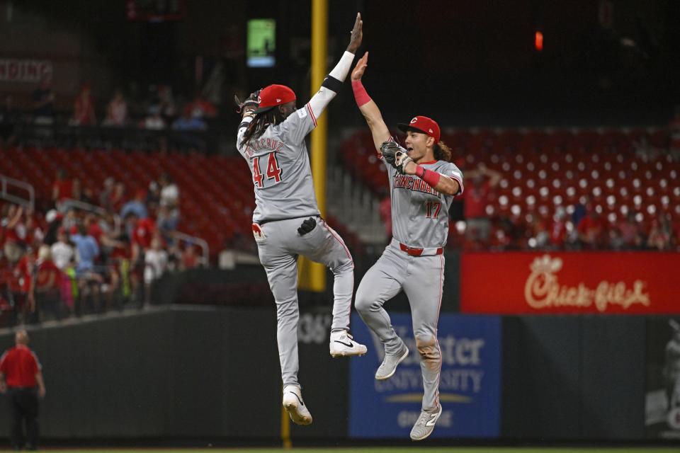 Cincinnati Reds shortstop Elly De La Cruz (44), left, celebrates with teammate Stuart Fairchild (17), right, after beating the St. Louis Cardinals in a baseball game Thursday, June 27, 2024, in St. Louis. (AP Photo/Joe Puetz)