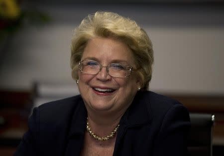 BAE Systems Inc CEO Linda Hudson smiles during the Reuters Aerospace and Defense Summit in Washington, September 3, 2013. REUTERS/Jason Reed