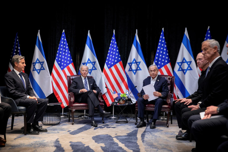 President Joe Biden pauses during a meeting with Israeli Prime Minister Benjamin Netanyahu, center right, to discuss the ongoing conflict between Israel and Hamas, in Tel Aviv on Oct. 18.