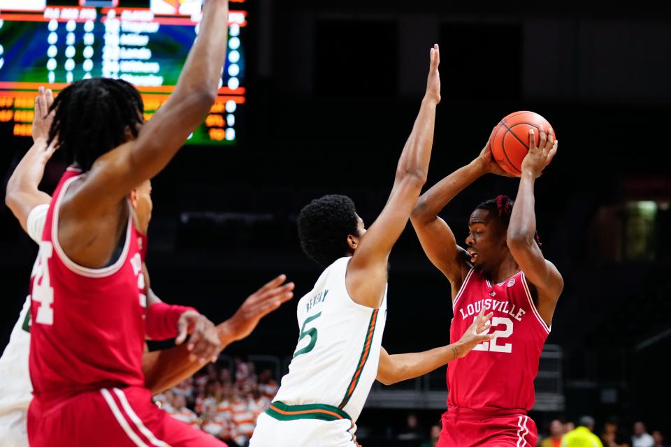 Feb 11, 2023; Coral Gables, Florida, USA; Louisville Cardinals forward Kamari Lands (22) throws a pass against the Miami (Fl) Hurricanes during the first half at Watsco Center. Mandatory Credit: Rich Storry-USA TODAY Sports