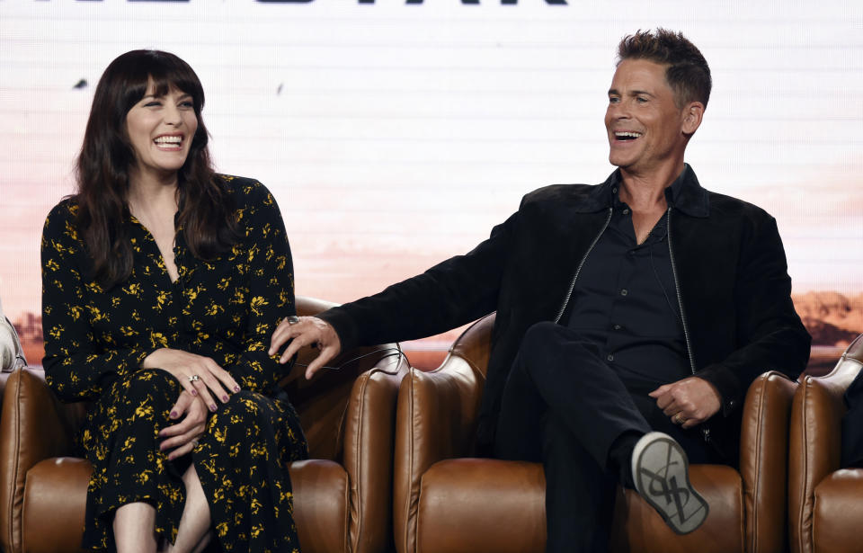 Rob Lowe, right, and Liv Tyler, cast members in the upcoming television series "9-1-1: Lone Star," share a laugh during the 2020 FOX Television Critics Association Winter Press Tour, Tuesday, Jan. 7, 2020, in Pasadena, Calif. (AP Photo/Chris Pizzello)