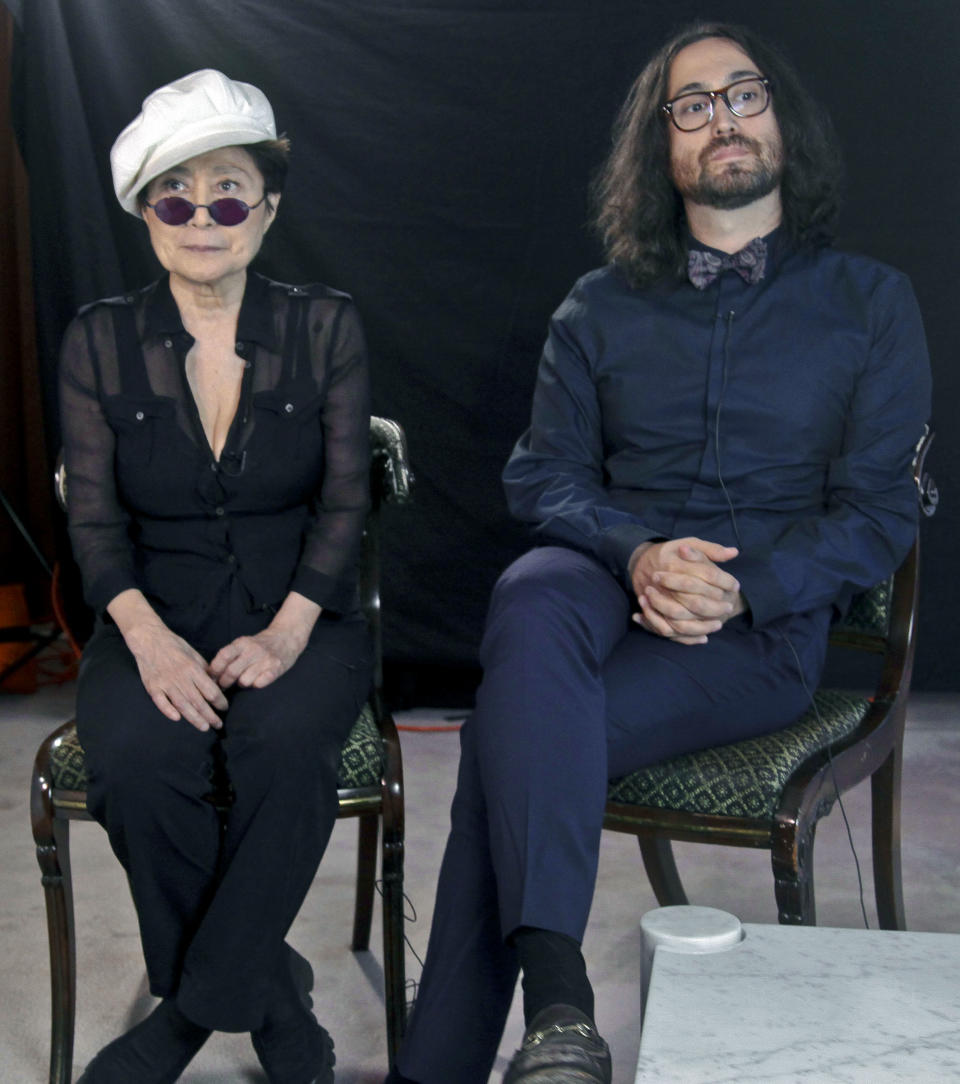 Yoko Ono, left, and her son Sean Lennon, right, listen during an interview, following the launch of a coalition of artists opposing hydraulic fracturing on Wednesday, Aug. 29, 2012 in New York. Lennon and Ono have joined the coalition called Artist Against Fracking to lobby Gov. Andrew Cuomo to ban the practice of drilling for gas in New York. (AP Photo/Bebeto Matthews)