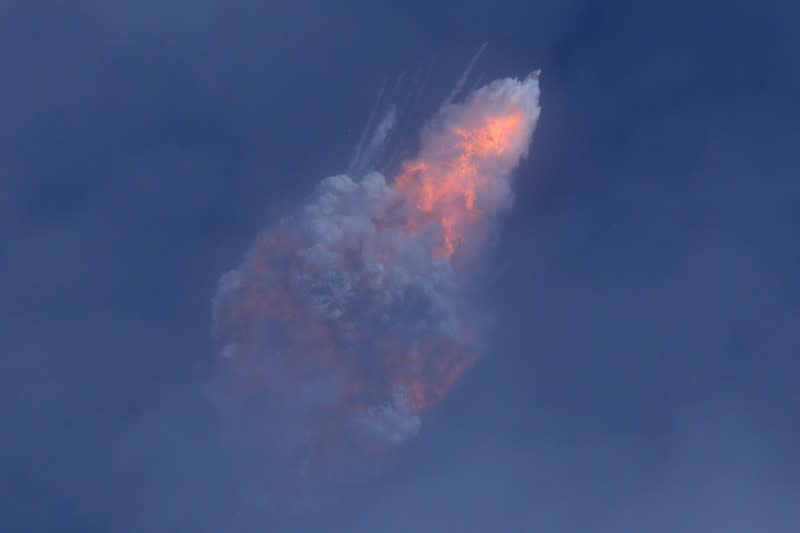 A SpaceX Falcon 9 rocket engine self-destructs after jettisoning the Crew Dragon astronaut capsule during an in-flight abort test after lift of from the Kennedy Space Center in Cape Canaveral